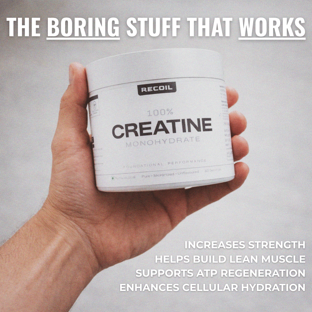 Hand holding a container of Recoil Creatine Monohydrate with text about its benefits on a plain background.